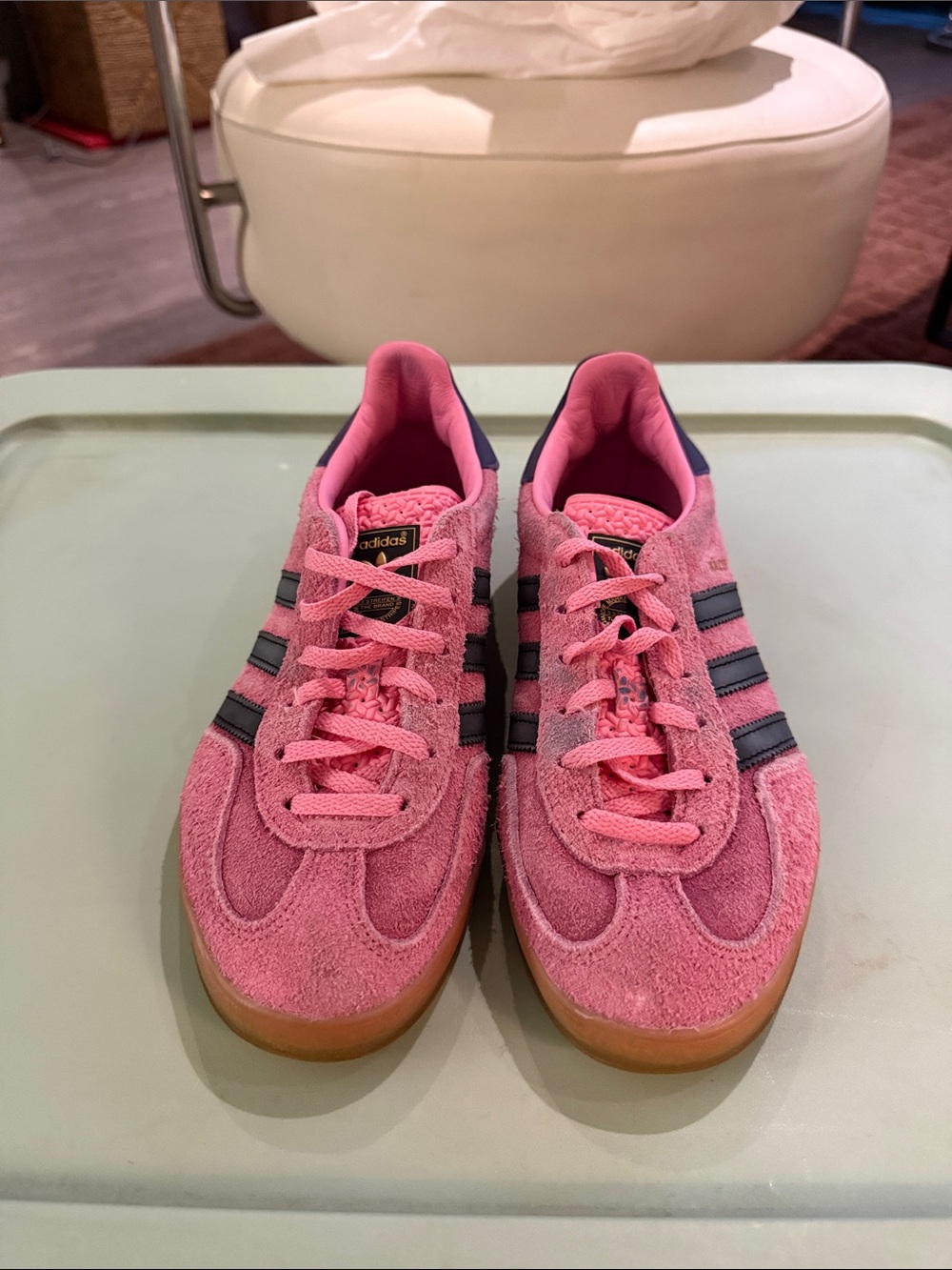 Adidas pink suede sneakers with dark purple stripes